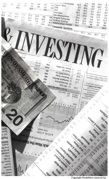 Newsprint stock tables and a folded twenty dollar bill